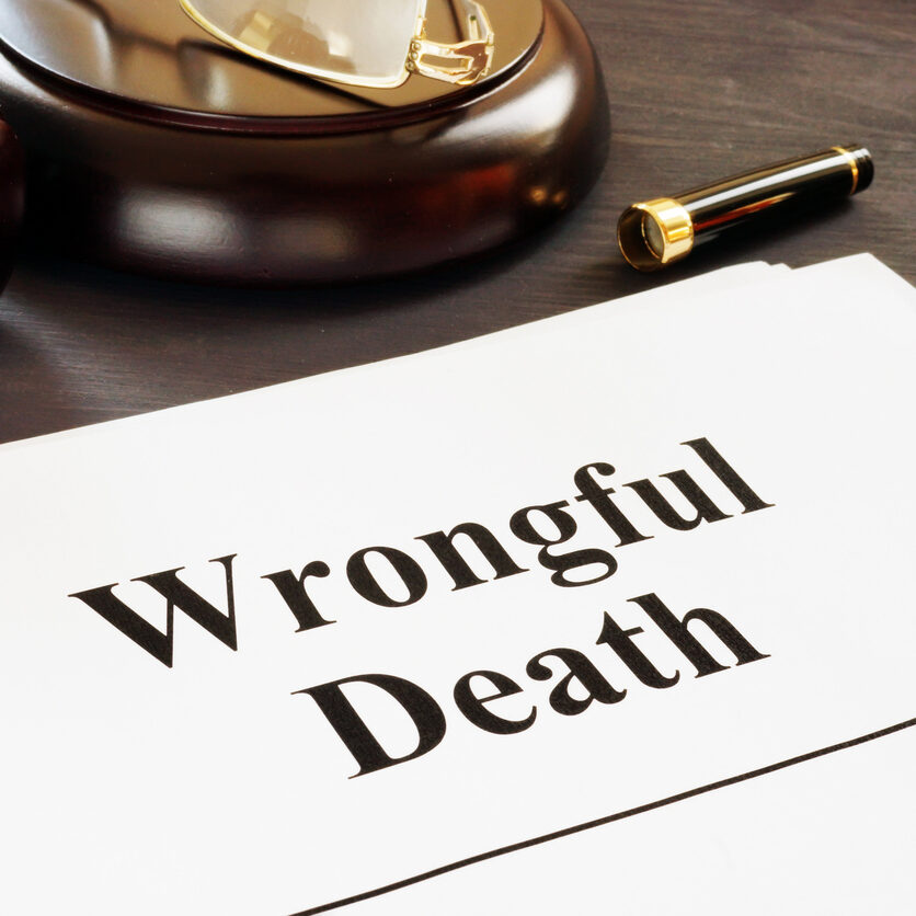 Wrongful Death report and gavel in a court.