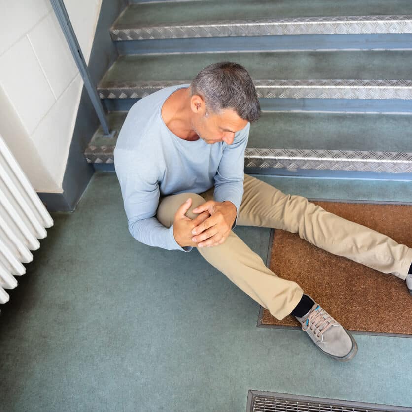 Mature Man Sitting On Staircase