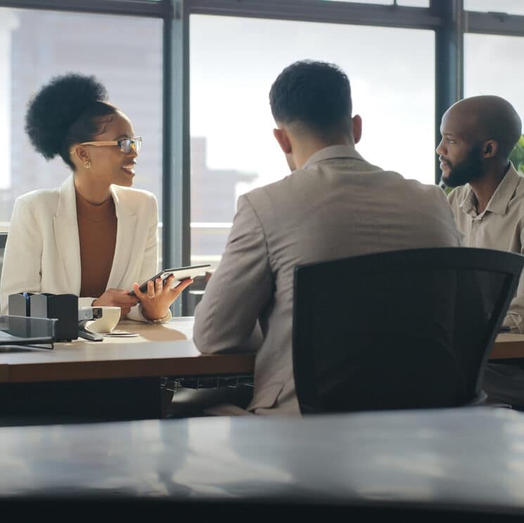 Client, negotiation meeting and business people communication for investment proposal offer or b2b contract deal. Law firm conversation, consulting or African lawyer talking with financial legal team