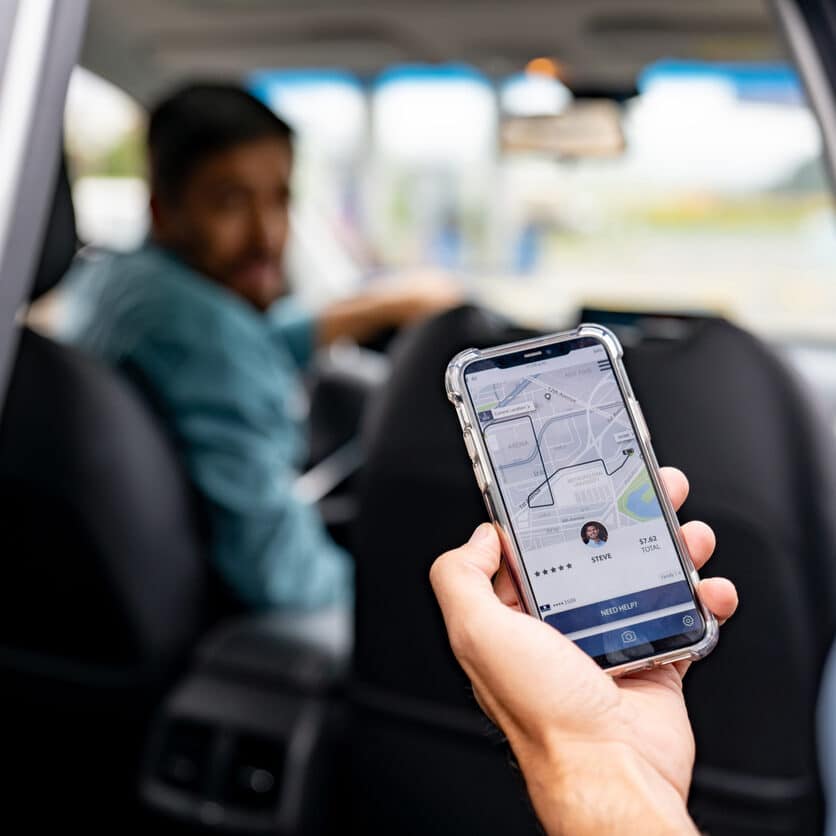 Man getting into a car he requested using a mobile app