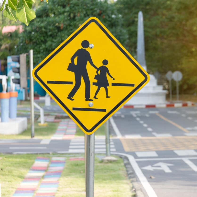 Students crossing ahead sign