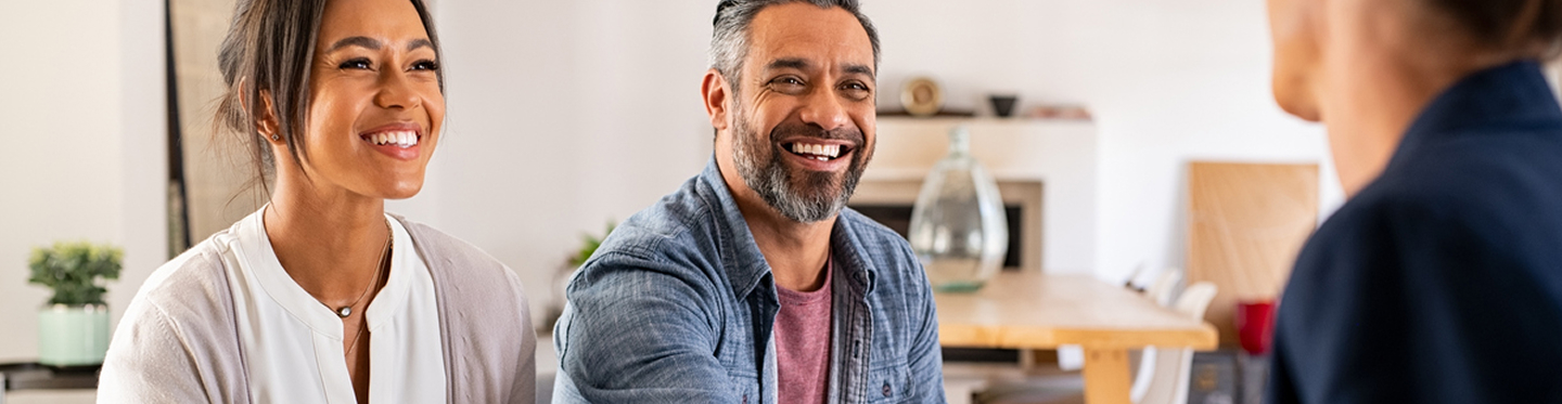 Two people talk to a lawyer